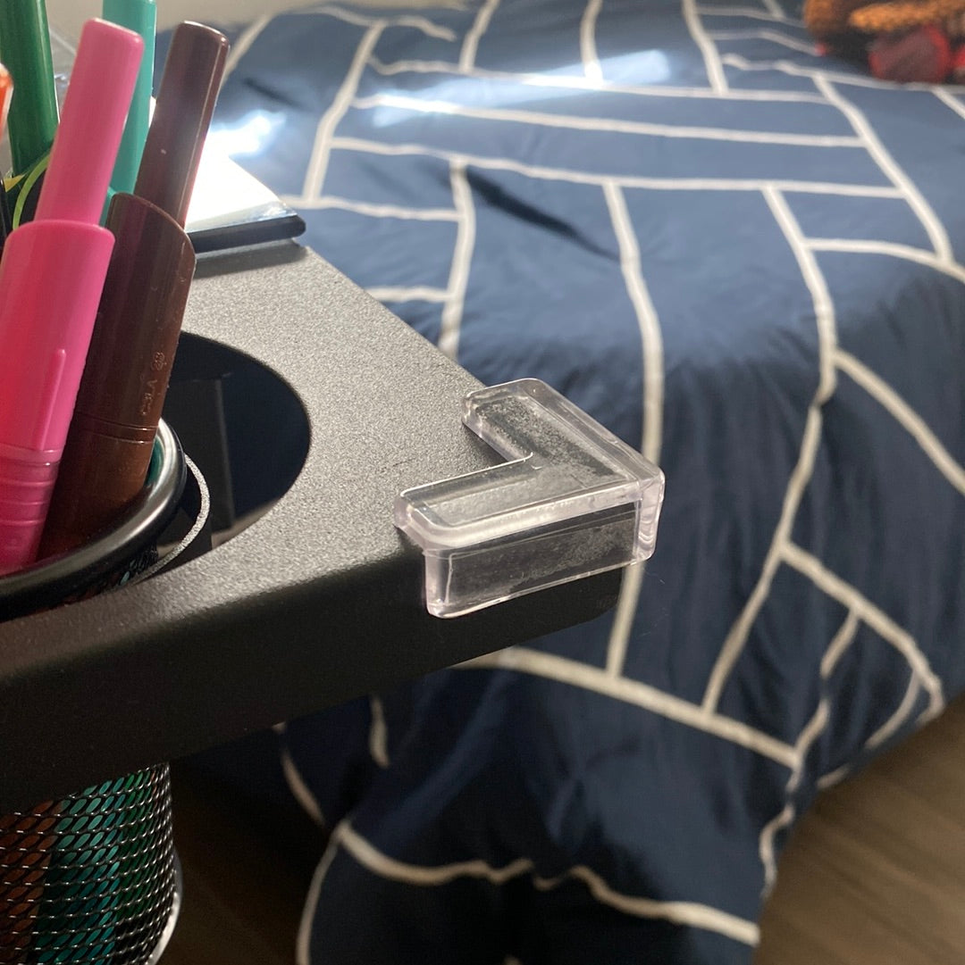 Clear corner guard in use on the edge of a desk